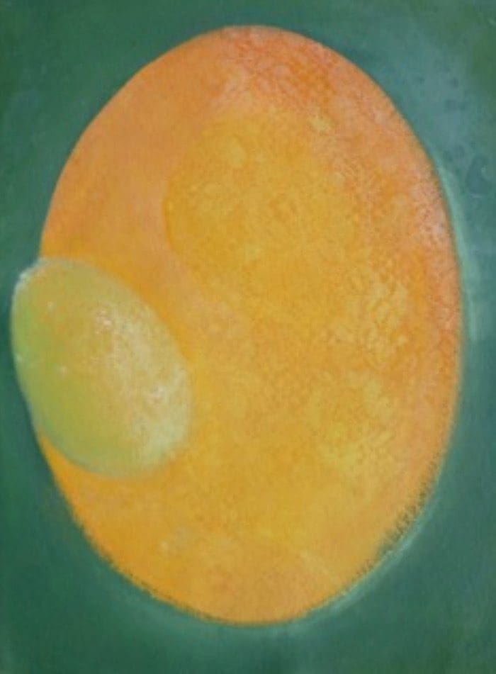 A painting that looks like a egg with a green substance