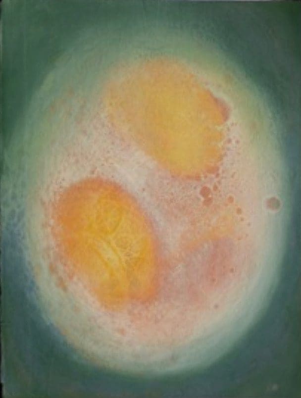 A painting that looks like a egg with two yolks
